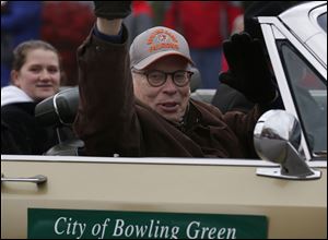 Bowling Green Mayor Dick Edwards waves during the city's holiday parade in 2016. Edwards said recently it was time for Bowling Green “take the gloves off” with a troublesome rental property near the BGSU campus.