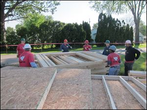 Habitat for Humanity workers build a home.