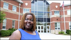 Velvet Saunders is shown outside of Jones Leadership Academy in Toledo. She is part of the first cohort of students to participate in a new program, Teach Toledo, aimed at educating and training home-grown Toledo teachers.