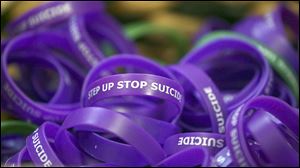 Bracelets to help spread the word about suicide prevention were available during a training for high school students.