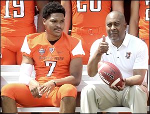 Bowling Green's Armani Posey looks over to coach Mike Jinks as he gives the thumbs up to the photographer start the team photo during Bowling Green State University's football media day last year.