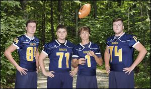 Whiteford football players from left to right Matt Taylor, Jarrett Atherton, Thomas Eitniear, and Lucas Tesznar hope to lead the Bobcats to a state title.