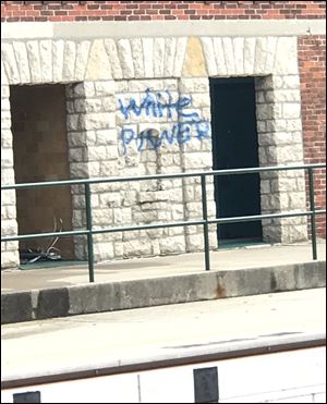 Crews worked during the day Monday to remove racist graffiti from Riverside Park in Findlay. A rally to protest white supremacy is planned for 4 p.m. Sunday. 