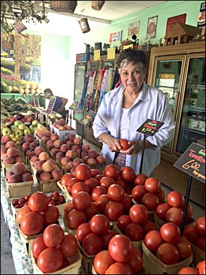 Diane Rogers hand picks local produce for her recipes. Here she is shopping at Thurman’s Farm Market on Kellogg Road.