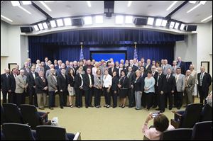 Kellyanne Conway, senior counselor to the President, takes a group photo with about 80 Ohio county commissioners during a meeting at the Eisenhower Executive Office. Lucas County’s commissioners did not go Tuesday.