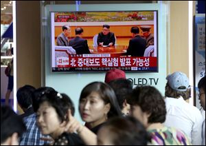 People watch a TV news program showing North Korean leader Kim Jong Un at the Seoul Railway Station in Seoul, Sunday, Sept. 3, 2017.