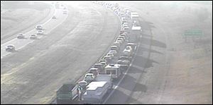 An ODOT camera shows traffic backed up near Hull Prairie Road heading toward the Route 25 exit on I-475 eastbound in Perrysburg.