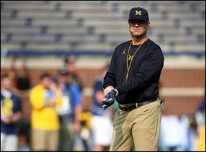 Michigan head coach Jim Harbaugh was the subject of online threats from a former UM player this week.