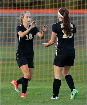 Perrysburg's Addie Graham (18) celebrates scoring a goal with Kristina Demarco during the 2017 season. Perrysburg made it to the state title game before falling.