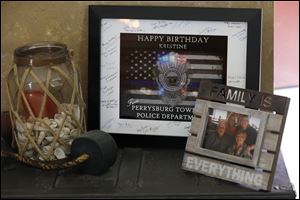 Kristine Keiser  received a signed card for her birthday from the Perrysburg Township Police Department, which she keeps framed in her living room. 