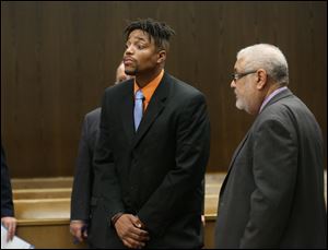 Julian Mack, with attorney Keith Mitchell, appears in Toledo Municipal Court in October. His disorderly conduct charge obtained Sept. 22 was dropped Tuesday evening.