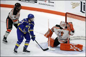 Bowling Green's Ryan Bednard watches the puck in a game earlier this season. Friday Bednard was named WCHA goalie of the month for November.