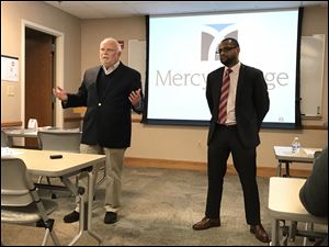 Jim Ruvolo and Derek Barnett give pro-and-con sides of Issue 2 to students and staff at Mercy College of Ohio in late October.