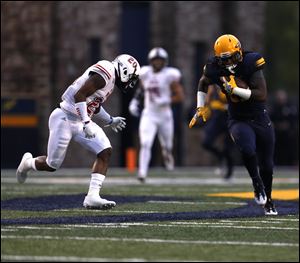 Toledo's Jordan Fisher finds running room during Thursday's 27-17 win over Northern Illinois.