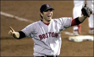 Doug Mientkiewicz begins to celebrate after catching the final out of the 2004 World Series while with the Boston Red Sox. Mientkiewicz was formally named the new Mud Hens manager Thursday.