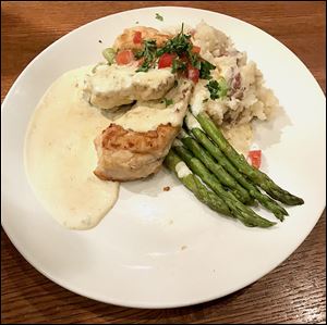 Chicken Limone with mashed potatoes, asparagus, and lemon buerre blanc sauce at Granite City Food & Brewery.
