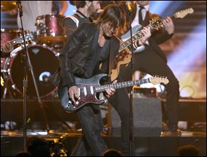 Keith Urban performs at the 51st annual CMA Awards at the Bridgestone Arena in Nashville, Tenn.