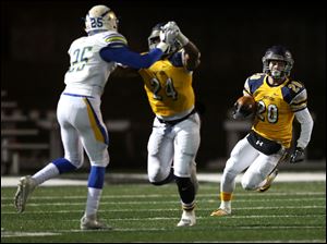 Whitmer's Sam Stickels finds running room during Friday's second round playoff game against Olentangy in Tiffin. 
