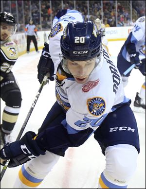 Toledo's Mike Borkowski controls the puck during Saturday's game against the Wheeling Nailers at the Huntington Center. Borkowski scored 3 goals in a 5-3 Walleye win.