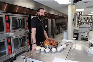 Chef Tony House, of Hensville and NINE, shows how to roast a moist and tasty turkey in Toledo, Ohio, on Nov. 7.