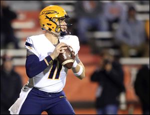 Toledo's Logan Woodside passed Bruce Gradkowski to become the Rockets' all-time leader in touchdown passes during Wednesday's 66-37 win over Bowling Green.