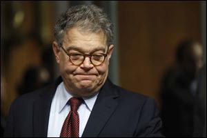 Sen. Al Franken, D-Minn., apologized Thursday after a Los Angeles radio anchor accused him of forcibly kissing her during a 2006 USO tour and of posing for a photo with his hands on her breasts as she slept. 