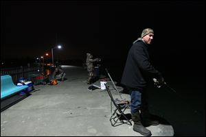 Ken Killingbeck takes part in the night bite phenomenon fishing for walleye along the breakwall in Luna Pier.  