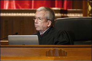 Ohio Supreme Court Justice William M. O'Neill listens during oral arguments for Preterm-Cleveland, Inc. v. Ohio Gov. John R. Kasich on Tuesday, September 26.