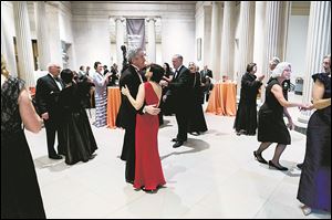Toledo Museum of Art board member Susan Palmer and her husband Tom Palmer take to the dance floor with other attendees during the Toledo Museum of Art’s formal celebration of The Polishing the Gem campaign that raised $43 million.
