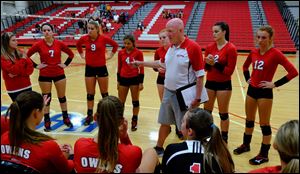Owens' assistant coach Denny Caldwell gives instruction during a timeout during volleyball game against Lorain County Community College this season. The Express finished this season 40-1 and national runner-up in NJCAA Division II.