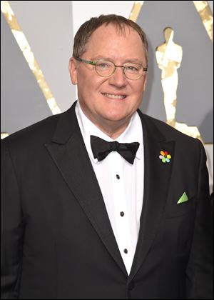 In this Feb. 28, 2016 file photo, Pixar co-founder and Walt Disney Animation chief John Lasseter arrives at the Oscars in Los Angeles. Lasseter is taking a six-month leave of absence citing missteps with colleagues.