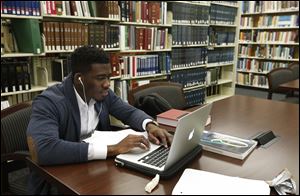 Law student Muheez Afolabi studies in one of the libraries at the University of Toledo Law Center in Toledo.