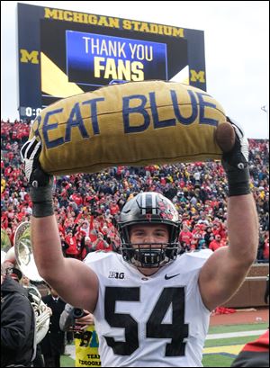 Ohio State center Billy Price celebrates after the Buckeyes' 31-20 victory at Michigan.