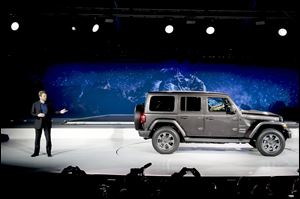Mike Manley, president and CEO of Jeep, introduces the 2019 Jeep Wrangler during the Los Angeles Auto Show, Wednesday, Nov. 29, 2017, in Los Angeles.