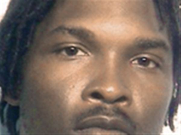 Police look for murder suspect