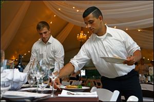 Members of University of Toledo's Sigma Phi Epsilon fraternity help set the tables during the PawVillion fundraiser for the Toledo Area Humane Society in 2016.The fraternity members volunteered their time through the Cherry Street Mission. 