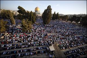 In this Sept. 24, 2015 file photo, Palestinians pray during the Muslim holiday of Eid al-Adha, near the Dome of the Rock Mosque in the Al Aqsa Mosque compound in Jerusalem's old city. Saudi Arabia has spoken out strongly against any possible U.S. recognition of Jerusalem as Israel’s capital.
