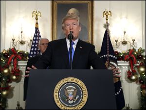 President Donald Trump speaks in the Diplomatic Reception Room of the White House, Wednesday, Dec. 6, 2017, in Washington.