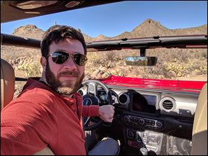 Blade staff writer Tyrel Linkhorn at the wheel of a Jeep Wrangler Rubicon during a test drive in Tucson, Arizona.