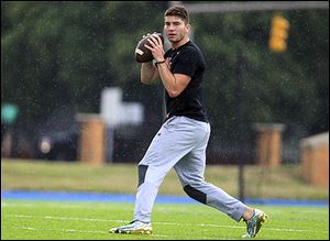 Shea Patterson practices with local football players at the St. Francis de Sales School football field during the summer of 2016. Patterson, a Toledo native and Ole Miss quarterback at the time, announced his decision to transfer to Michigan on Monday. 