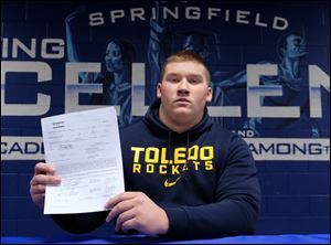 Springfield High School football player Tyler Long signed a letter of intent to play football at University of Toledo on Wednesday.