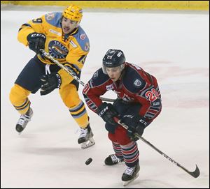 Erik Bradford, left, shown in a game earlier this season, scored the only Walleye goal Friday.