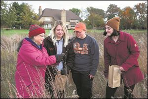 Helen Michaels, left, an associate professor in biological sciences at Bowling Green State University, teaches a restoration ecology class. 
