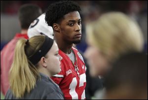 Ohio State cornerback Denzel Ward watches from the sideline during the first half of Friday's Cotton Bowl.