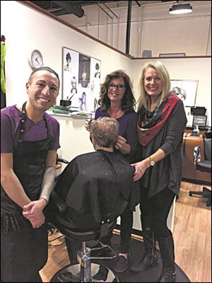 From left: Mikey DelVecchio, Sandy Kay Fleig, and owner Peggy George at Definitions hair salon.