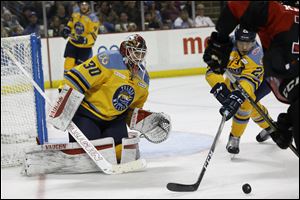 Toledo's goalie Pat Nagle rebuffs a shot on goal against Cincinnati. 