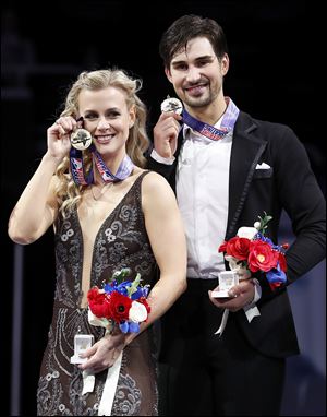Madison Hubbell, left, and Zachary Donohue pose after winning the free dance event Sunday.