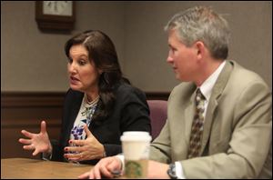 Gubernatorial candidate Mary Taylor speaks during Thursday's interview at The Blade as running mate Nathan Estruth listens.