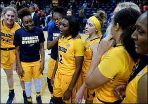 Toledo's Mikaela Boyd (2) is surrounded by her teammates after she earned her fourth double-double in five games. Boyd finished Saturday's game against Northern Illinois with 17 points and 13 rebounds.