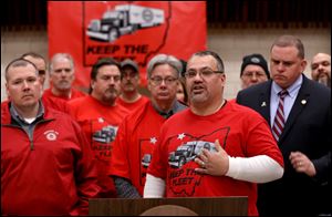 Fiat Chrysler Transportation fleet driver Sysco Garza speaks during a protest at UAW Local 12 against the proposed elimination of jobs at the Toledo Jeep transportation facility in Toledo.